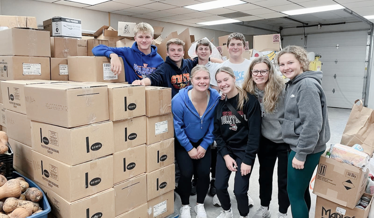 Youth serving together at a community outreach project